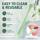 Green reusable silicone tongue scraper with textured bristle tip and curved end