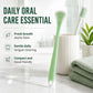 Green double-sided silicone tongue scraper with textured brush tip