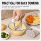 Manual potato masher with spare perforated plate on the side; used over a glass bowl