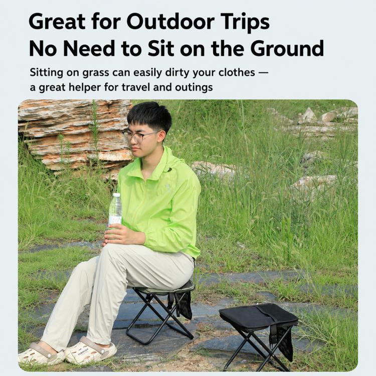Camping foldable stool with black fabric seat and legs, used outdoors