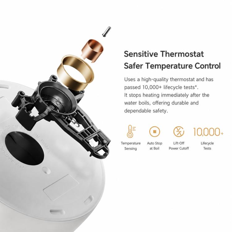 White electric kettle open view with copper-colored thermostat component.