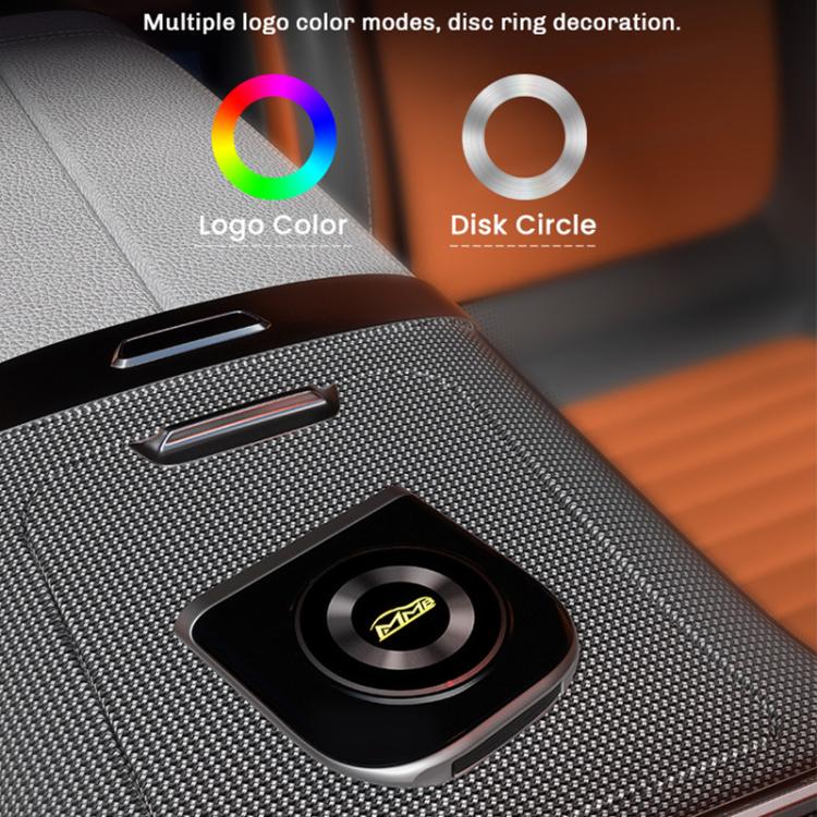 Car smart box module with glowing logo ring on textured dashboard insert