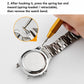 Yellow spring bar tool pressing a spring bar on a metal watch band