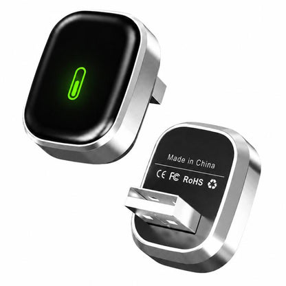 Wireless car smart adapter, black oval module with green light and silver mount