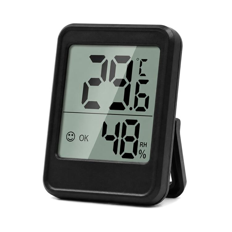 Indoor digital thermometer and hygrometer with black frame and LCD showing temp and humidity