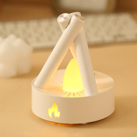 White campfire night light with glowing yellow flame effect and three arched legs.