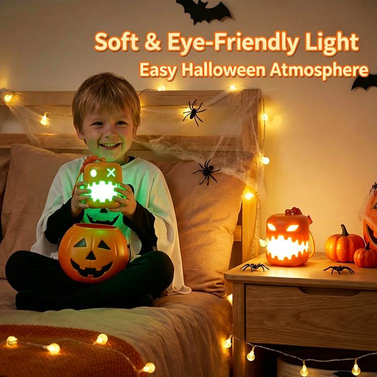 Glowing jack-o'-lantern pumpkin lantern night light held in a child’s hands.