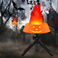 Orange simulated flame LED lamp with red flame effect on a tripod stand.
