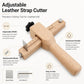 Adjustable leather strap cutter with wooden handle, marked guide scale, and spare blade