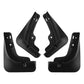 Set of four black car mud flaps with mounting brackets and screw holes