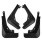 Four black molded mud flaps set, showing curved splash guard shapes