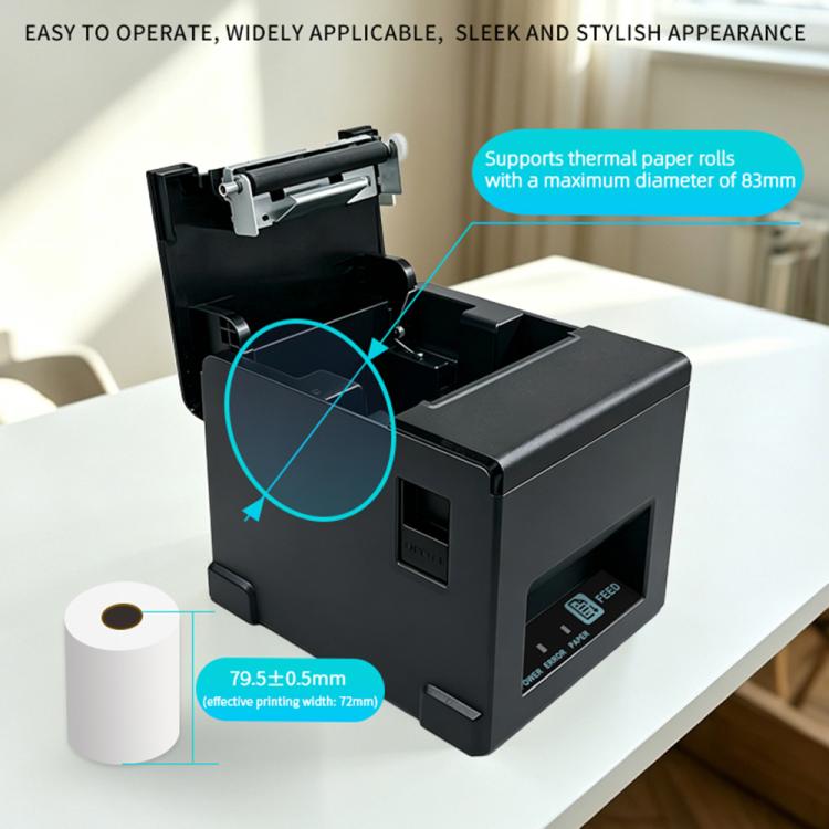 Thermal receipt printer on desk with open cover, showing thermal paper loading area
