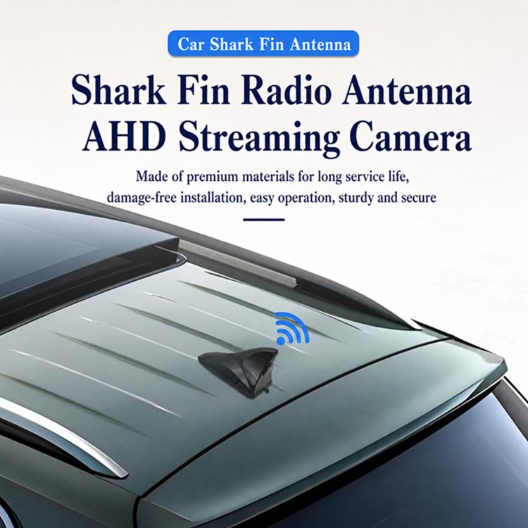 Shark-fin antenna mounted on car roof with compact camera housing