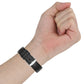 Black 20mm watch strap on a wrist with metal buckle and adjustment holes