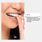 Denture set being placed by hand inside the mouth
