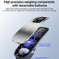 Handheld luggage scale open to show internal weighing components and replaceable battery