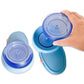 Hand holds clear lid of blue electric bead spinner with two other lids