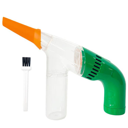 Handheld electric bead/dust suction cleaner with green body, orange nozzle, brush