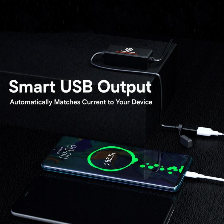 Black USB charger module delivering charging to smartphone via connected USB lead