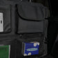 Black car trunk organizer close-up of large flap pocket with zipper and mesh panels