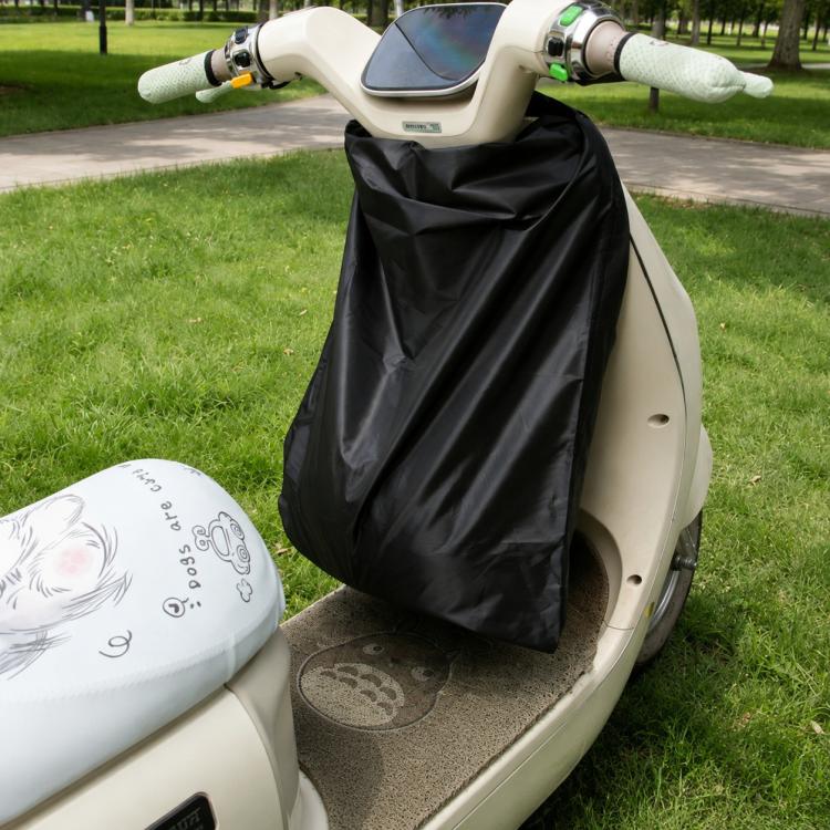 Black motorcycle helmet storage bag, large opening draped over scooter seat