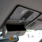 Carbon fiber-look reading light trim sticker installed around the overhead light lens