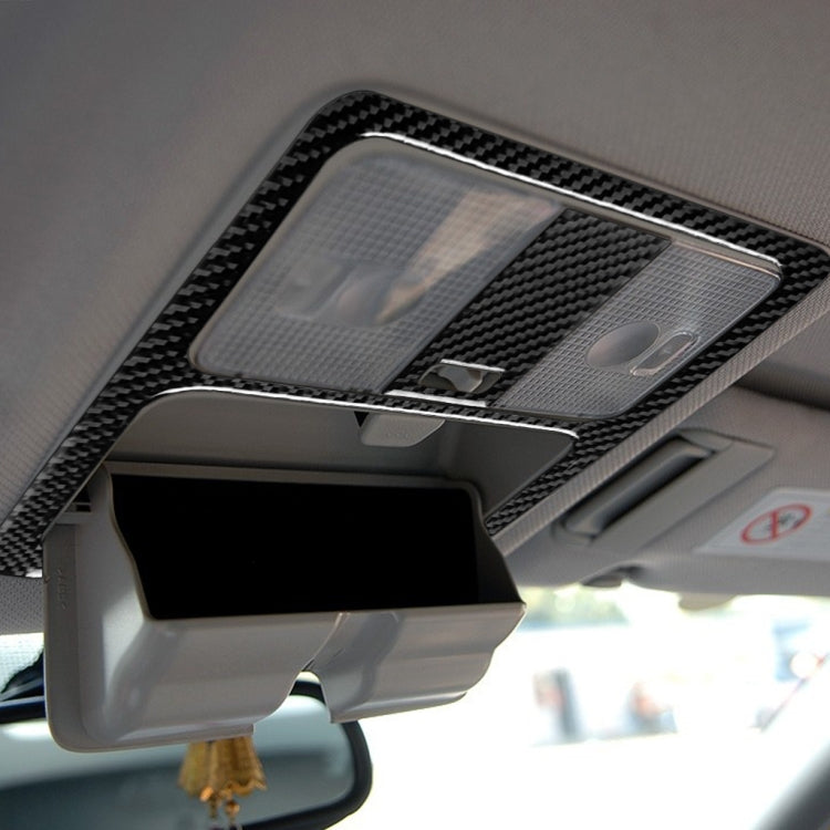 Carbon fiber-look reading light trim sticker installed around the overhead light lens