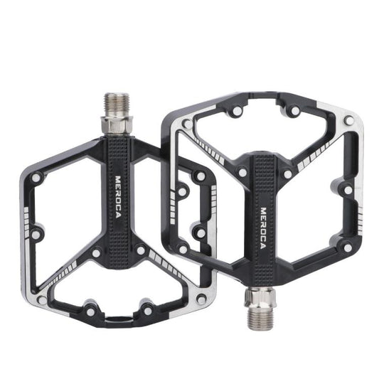 Black mountain bike pedals with dual platform and threaded axle