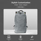 Light gray nylon backpack with front zipper pocket, black shoulder straps, and top handle