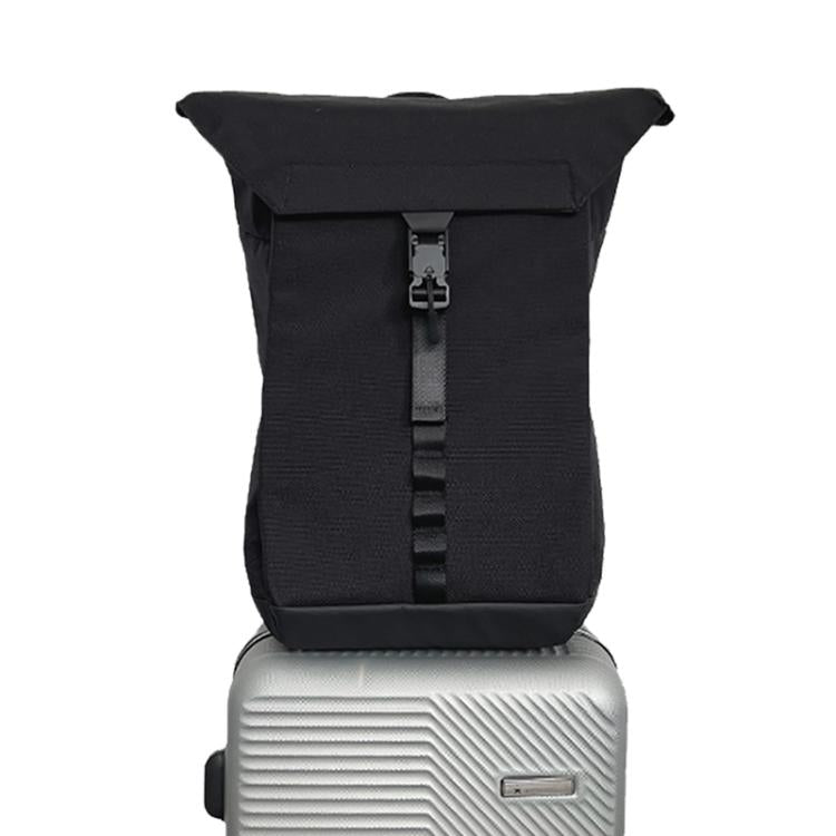 Black roll-top backpack with front webbing strap and buckle closure