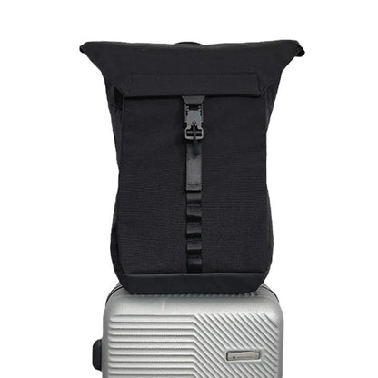 Black roll-top backpack with front webbing strap and buckle closure