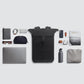 Black roll-top backpack with front buckle strap and structured, padded back