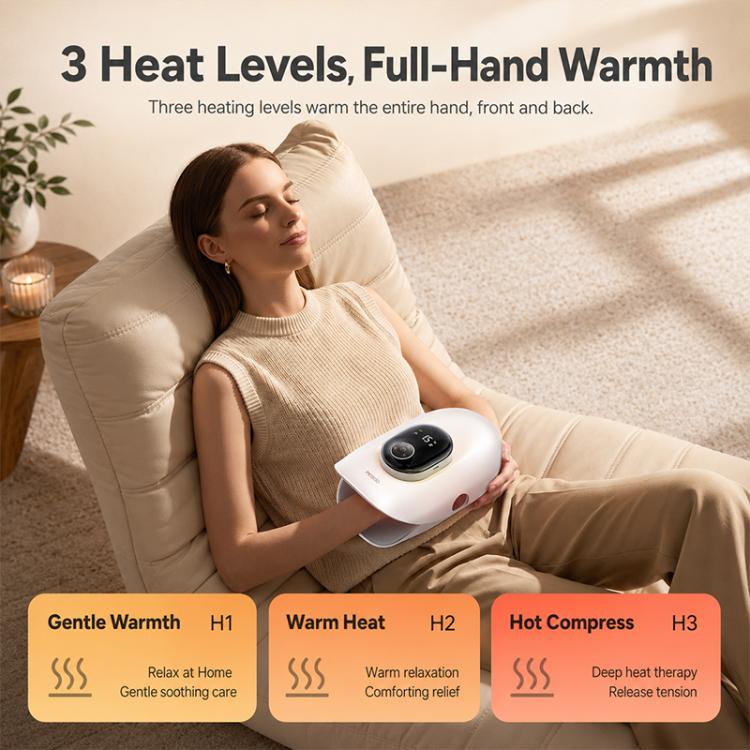 White heated airbag hand massager on a seated person’s hands