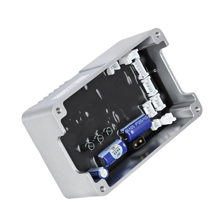 Motor controller circuit board inside silver housing, showing connectors and blue capacitors