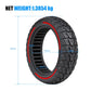 Black off-road solid tire with red inner rim and multi-directional tread