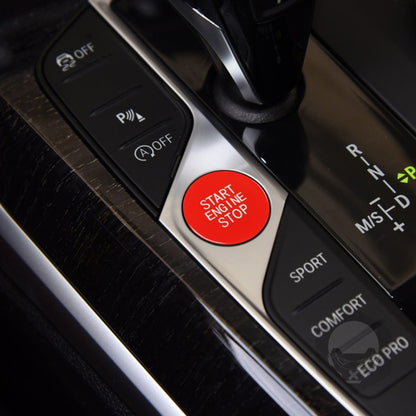 Car engine start/stop push button in red with START ENGINE STOP text