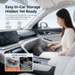 Handheld silver vacuum cleaner with orange accents, being used inside a car