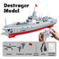 RC destroyer model with gray deck and red bow stripe, remote controller shown
