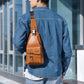 Men's vintage PU leather sling bag in tan with top zipper and adjustable shoulder strap