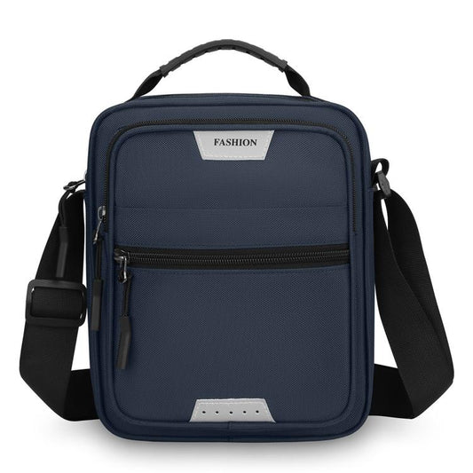Men’s large crossbody bag in navy blue, with front zip pocket and adjustable shoulder strap