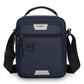 Men's blue crossbody bag with top handle, front zip pocket, and shoulder strap