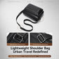 Black crossbody bag with adjustable shoulder strap and metal strap connector detail.