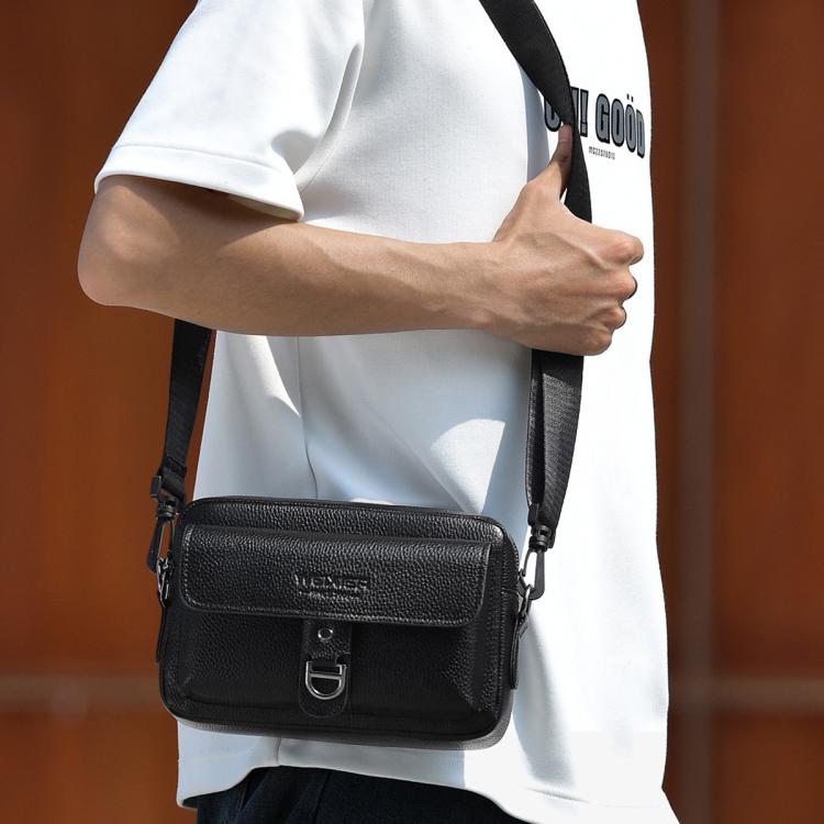 Black textured lychee crossbody bag with flap and adjustable shoulder strap