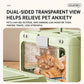 Green pet carrier with transparent front window and a cat looking out