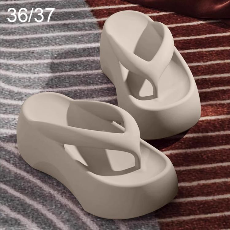 Oatmeal/cream EVA thick-soled flip-flops with wide crisscross strap and raised platform.