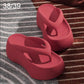 Rose red EVA thick-soled flip-flops, front view with wide open crisscross strap.