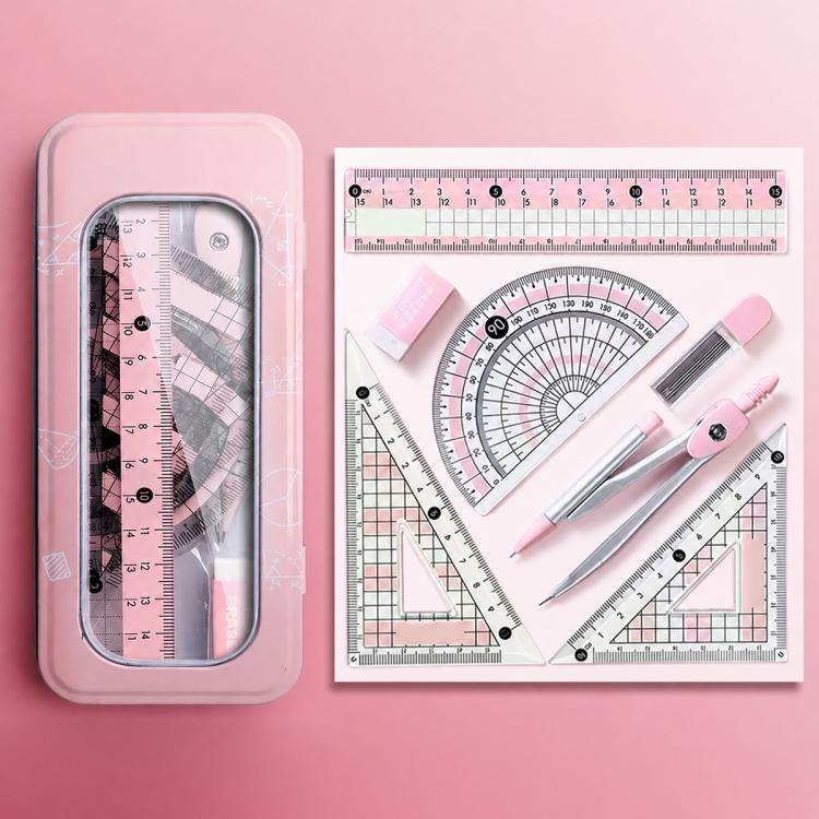 Pink plastic case holding a compass, rulers, and triangle guides
