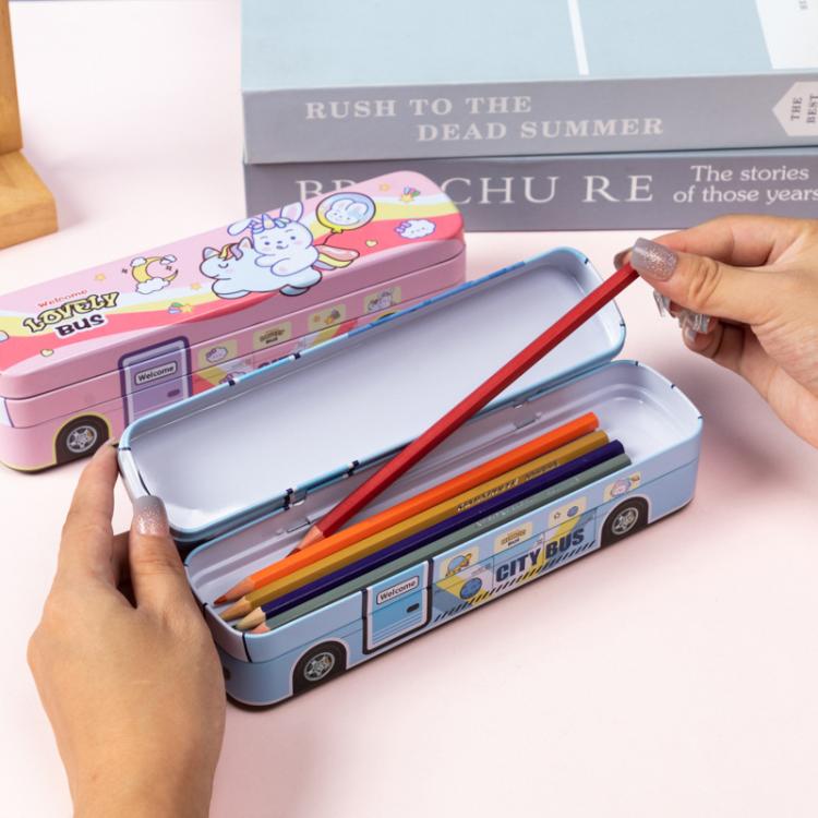 Blue and pink cartoon bus pencil boxes with lids open, pencils inside the tray