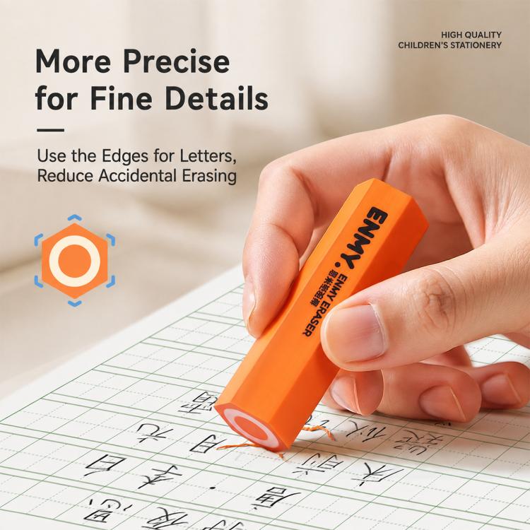 Orange hexagonal pencil-shaped eraser in hand over printed grid paper