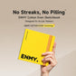 ENMY EvenHue sketchbook, yellow square cover with tan stitched spine held in hand